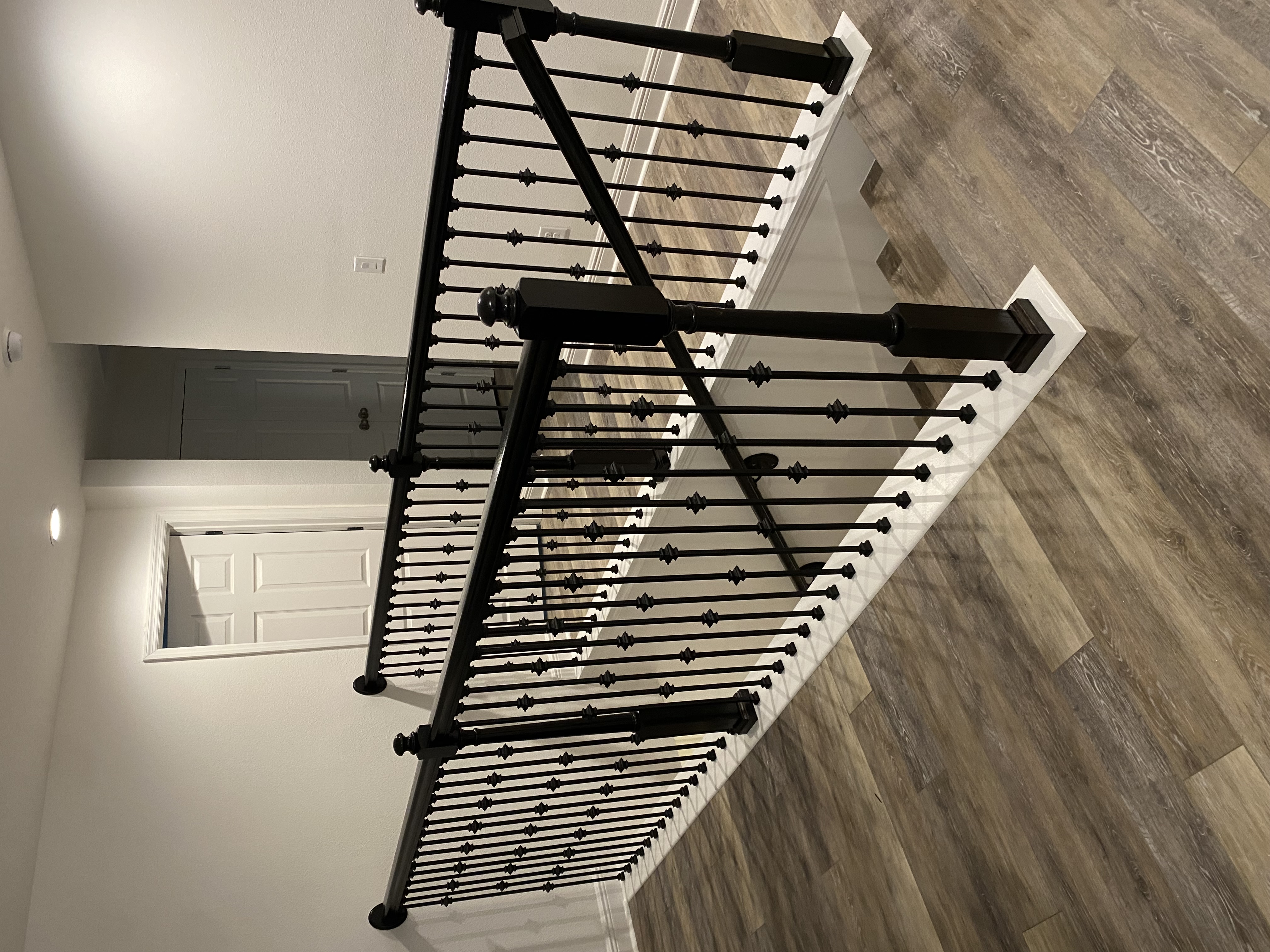 Custom metal and wood staircase handrail installation in Clermont FL